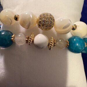 bracelet set blends soft elegance with a refreshing pop of color
